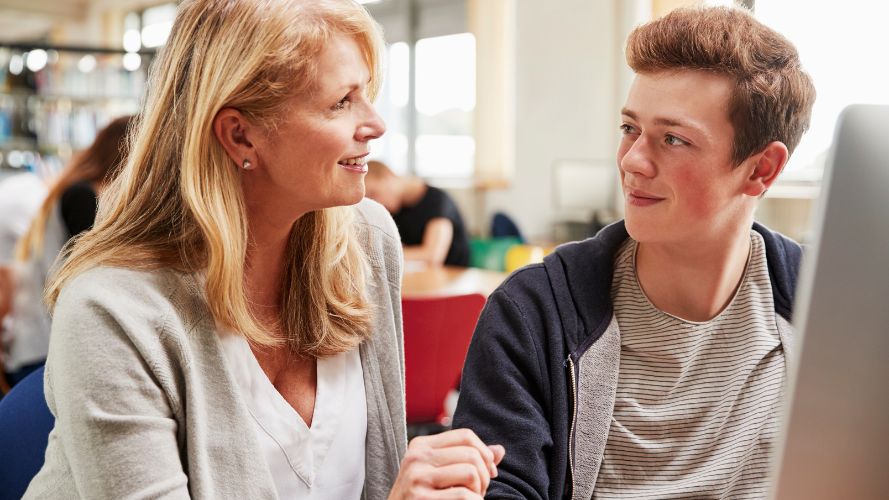 teacher and student in computer room